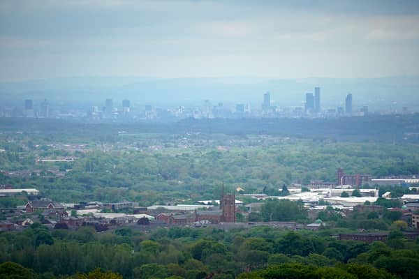 A view of Bolton with Manchester looming large in the background