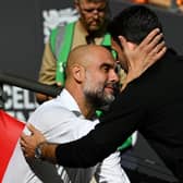 Pep Guardiola (left) and Arsenal manager Mikel Arteta