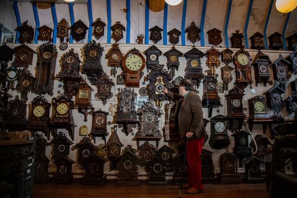 Roman Piekarski, 71, begins turning back clocks at their museum, Cuckooland, in Cheshire. Picture: William Lailey/SWNS