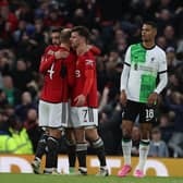 Bruno Fernandes, Christian Eriksen and Mason Mount celebrate the FA Cup win over Liverpool
