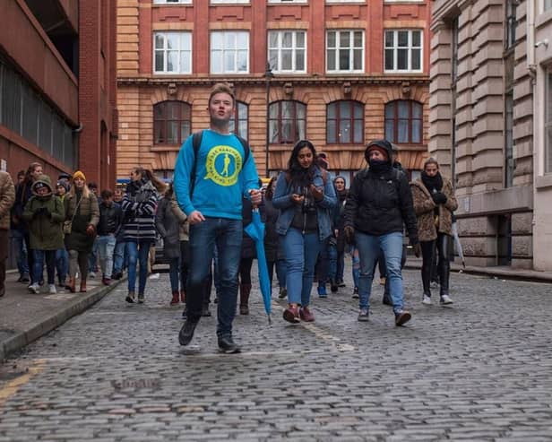 Josh Martin leading a group on one of his Manchester walking tours. Credit: Josh Martin