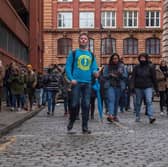 Josh Martin leading a group on one of his Manchester walking tours. Credit: Josh Martin