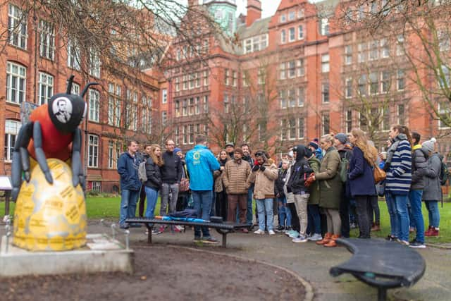 Josh Martin leading a tour group at Sackville Gardens, near Manchester's Gay Village. Credit: Josh Martin