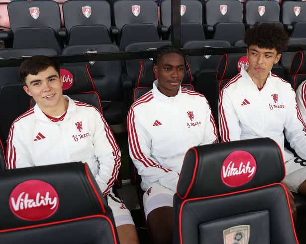 Harry Amass, Habeeb Ogunneye, Ethan Wheatley and Omari Forson sit on the bench ahead of the Premier League match between AFC Bournemouth and Manchester United