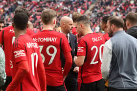 Erik ten Hag talks to the players ahead of the penalty shootout win