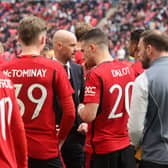 Erik ten Hag talks to the players ahead of the penalty shootout win