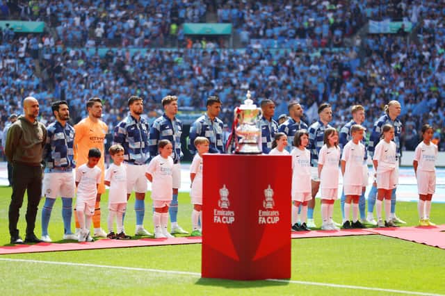 City players line up behind the Emirates FA Cup win over United last year