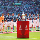 City players line up behind the Emirates FA Cup win over United last year