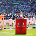 City players line up behind the Emirates FA Cup win over United last year