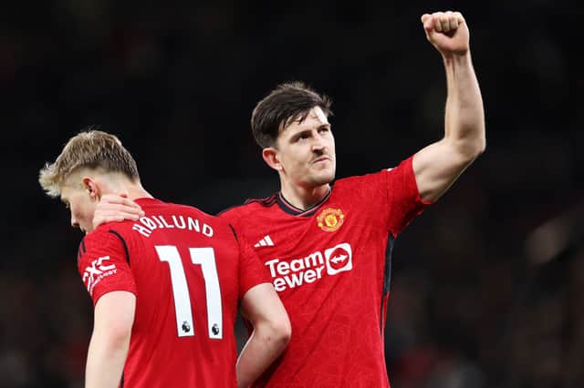 Harry Maguire celebrates his side's fourth goal with Rasmus Hojlund