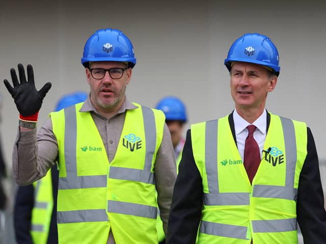 Gary Roden, left, with Chancellor Jeremy Hunt during the construction of Co-op Live