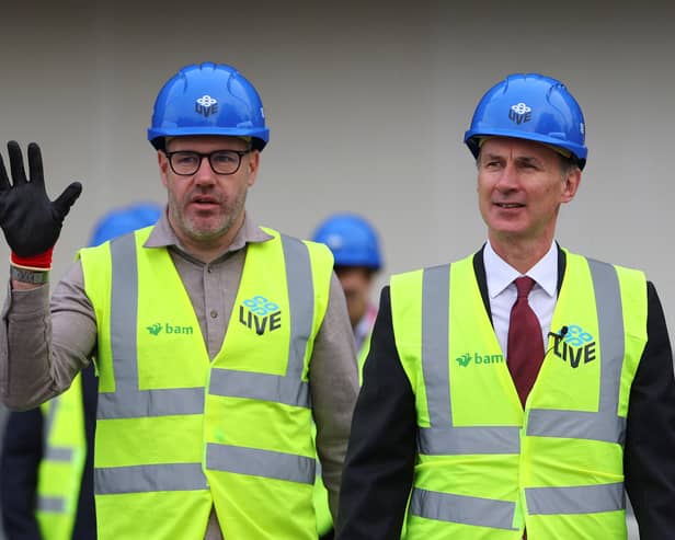 Gary Roden, left, with Chancellor Jeremy Hunt during the construction of Co-op Live