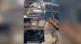 Fire from suspected lightning strike causes damage to home.