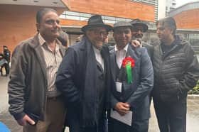 Rochdale MP George Galloway celebrates with his Workers Party of Great Britain candidate Shabaz Sarwar at the Manchester City Council elections.