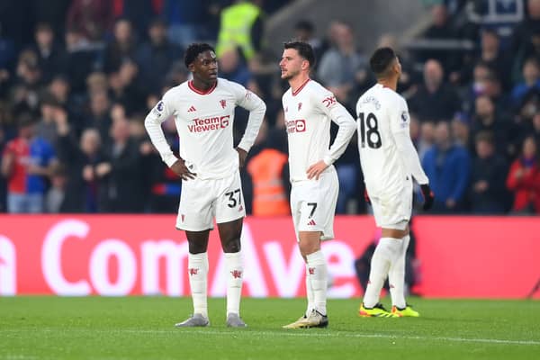 Kobbie Mainoo and Mason Mount of Manchester United look dejected in the Crystal Palace defeat