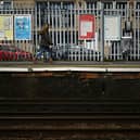 A person walks along a railway platform at Paddock Wood railway station in south east England on April 8, 2024, as train drivers strike over pay. (Photo by BEN STANSALL/AFP via Getty Images)