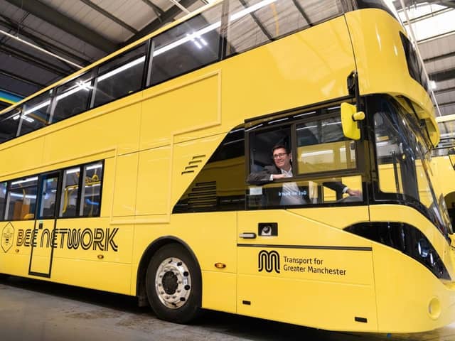 Andy Burnham inside a yellow Bee Network bus. In total, it cost £500k to turn the whole fleet of buses yellow. Credit: TfGM