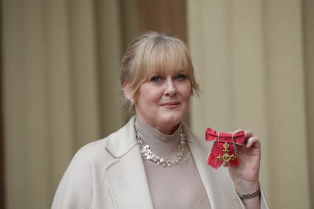 Actress Sarah Lancashire poses after she was awarded an OBE by Duke of Cambridge