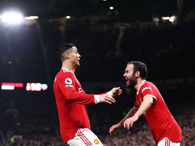 Cristiano Ronaldo celebrates with Juan Mata at Old Trafford