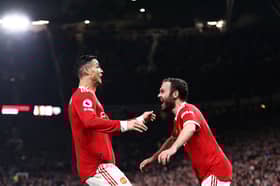 Cristiano Ronaldo celebrates with Juan Mata at Old Trafford