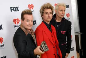  (L-R) Tré Cool, Billie Joe Armstrong and Mike Dirnt of Green Day, winners of the Landmark Award, pose in the press room during the 2024 iHeartRadio Music Awards at Dolby Theatre on April 01, 2024 in Hollywood, California