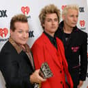 (L-R) Tré Cool, Billie Joe Armstrong and Mike Dirnt of Green Day, winners of the Landmark Award, pose in the press room during the 2024 iHeartRadio Music Awards at Dolby Theatre on April 01, 2024 in Hollywood, California
