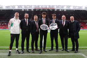Ethan Wheatley and Elyh Harrison collect the Jimmy Murphy Young Player of the Year award and the Denzil Haroun Reserve Team Player of the Year award at Old Trafford.