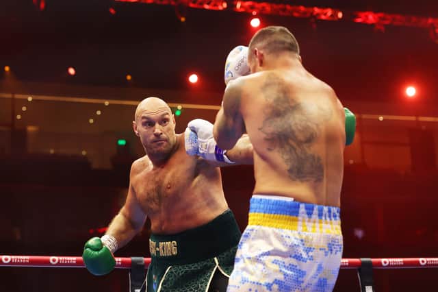 Tyson Fury punches Oleksandr Usyk during their clash for the undisputed heavyweight crown. Picture: Getty Images
