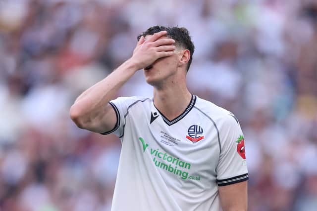 Bolton's Eoin Toal can't hide his disappointment after their defeat against Oxford 