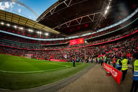 Manchester United fans celebrate at the end of the Emirates FA Cup Semi Final match between Coventry City and Manchester United