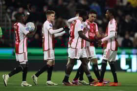 Brian Brobbey celebrates with teammates after scoring for Ajax