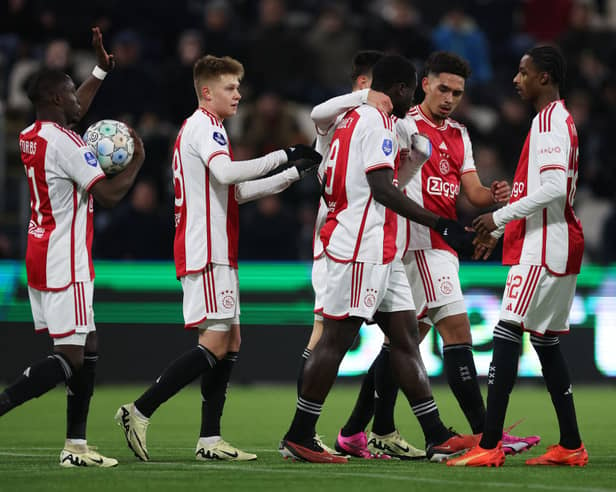 Brian Brobbey celebrates with teammates after scoring for Ajax