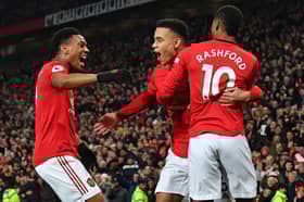 Mason Greenwood celebrates with Anthony Martial and Marcus Rashford