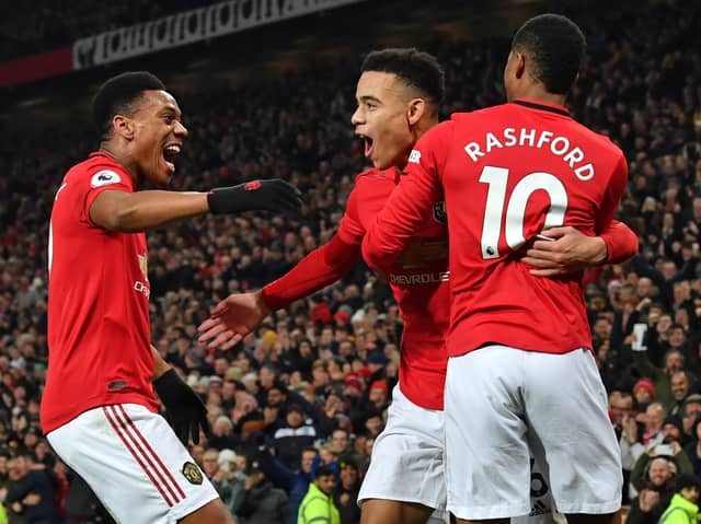 Mason Greenwood celebrates with Anthony Martial and Marcus Rashford