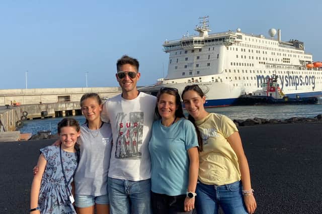Simon Latham, 39, and his wife Amélie, 43, with their three daughters - Zara, 14, Héloïse, 12, and Sophie, 10. 