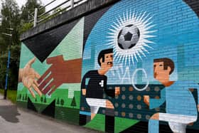 The new Stanley Chow x Akse P19 mural on the CityLink walking route between Manchester city centre and the Co-op Live. 