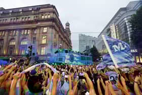 Manchester City players celebrate on the open top bus during the Manchester City trophy parade on June 12, 2023 in Manchester, England. (Photo by George Wood/Getty Images)