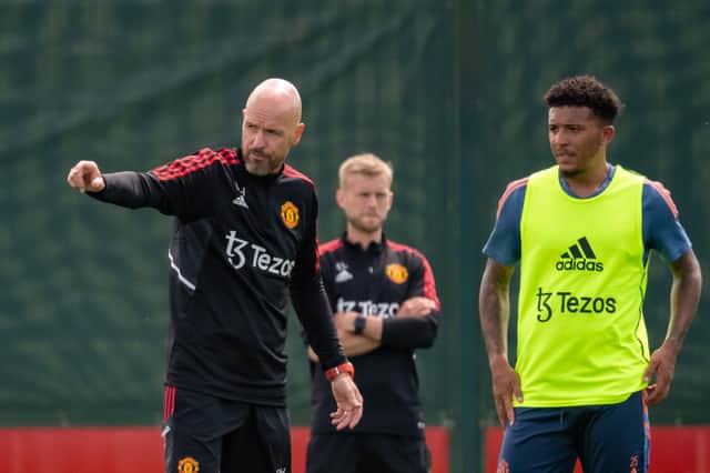 Erik ten Hag and Jadon Sancho of Manchester United