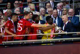 Manchester United lift the FA Cup trophy after victory over Man City