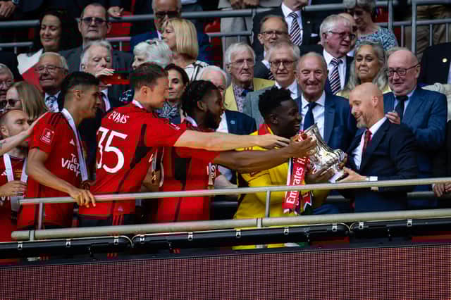 Manchester United lift the FA Cup trophy after victory over Man City