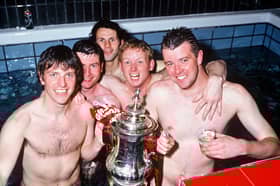 Lee Sharpe, Denis Irwin, Ryan Giggs, David May and Gary Pallister celebrate Manchester United winning the 1996 FA Cup. 