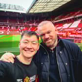 Manchester United fan Ochirvaani Batbold , 27, meets Wayne Rooney after cycling all the way to the football club's stadium from Mongolia. 