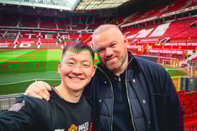 Manchester United fan Ochirvaani Batbold , 27, meets Wayne Rooney after cycling all the way to the football club's stadium from Mongolia. 