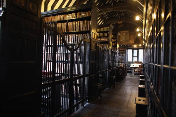 Chetham's Library is the site of one of Manchester's enduring urban legends. It is here that adviser to Queen Elizabeth I, John Dee, is said to have summoned the devil, leaving a burn mark that can still be found there today. Credit: Getty