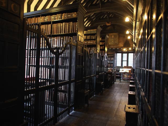 Chetham's Library is the site of one of Manchester's enduring urban legends. It is here that adviser to Queen Elizabeth I, John Dee, is said to have summoned the devil, leaving a burn mark that can still be found there today. Credit: Getty