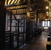 Chetham's Library is the site of one of Manchester's enduring urban legends. It is here that adviser to Queen Elizabeth I, John Dee, is said to have summoned the devil, leaving a burn mark that can still be found there today. Credit: Getty