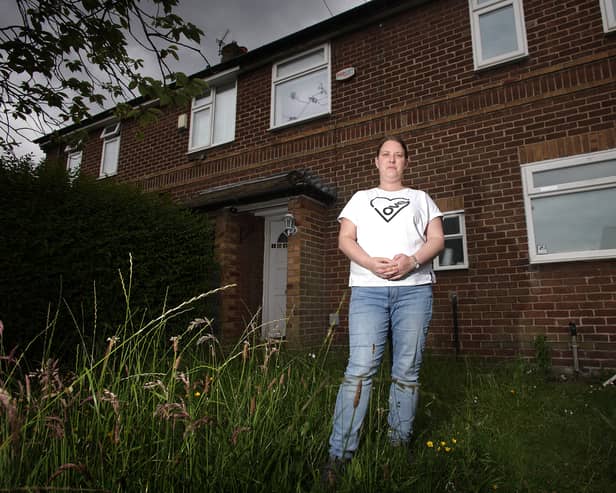 Katie Collins at her house in Swinton, where she lives with her three kids, one of whom has complex medical needs. She has been in temporary accommodation for two years and desperately needs a bigger house with the proper adaptations to look after her daughter.  Credit: Manchester Evening News