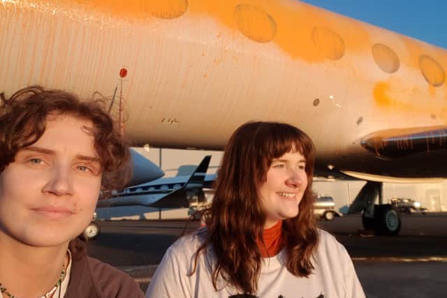 Just Stop Oil protesters Jennifer Kowalski and Cole Macdonald on the Stansted airfield (Credit: Just Stop Oil)