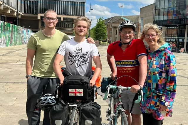 Jamie Hargreaves (centre left) with his family before setting out for his cycle to Australia on the same bike his father used to make the trip 40 years earlier. 