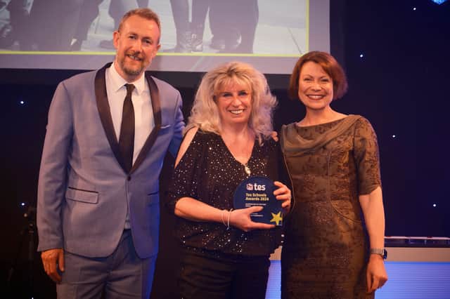 Lyn Williams, head of St. Peter's CE Primary in Bolton, receives her award for Headteacher of the Year at the Tes Schools Awards 2024, hosted by Taskmaster's Alex Horne. Credit: Tes